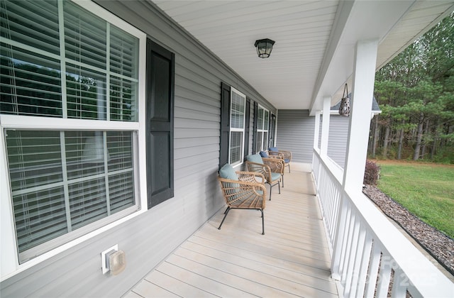 wooden terrace featuring a porch
