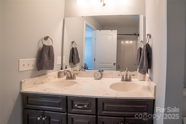 full bath featuring double vanity and a sink