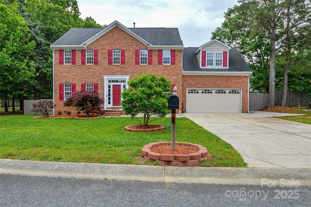 colonial house featuring brick siding, concrete driveway, a garage, and entry steps