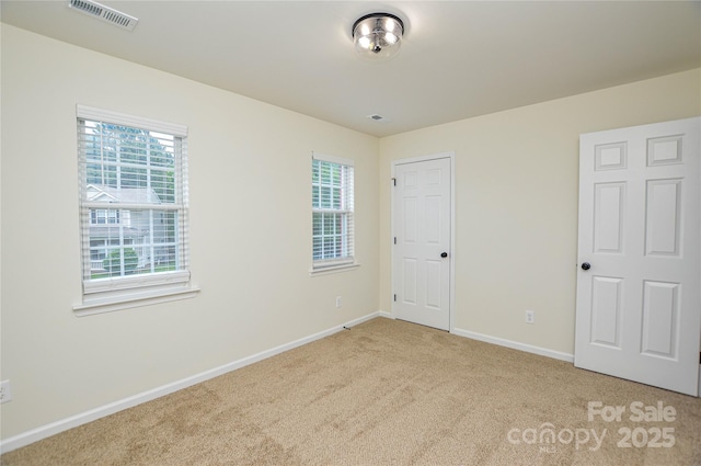 unfurnished bedroom with carpet and baseboards