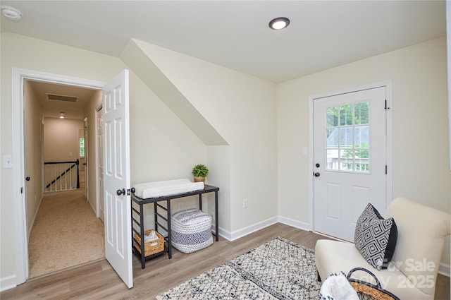 entryway featuring wood finished floors and baseboards