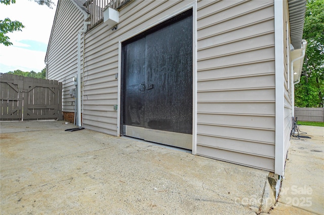 property entrance featuring fence and a gate