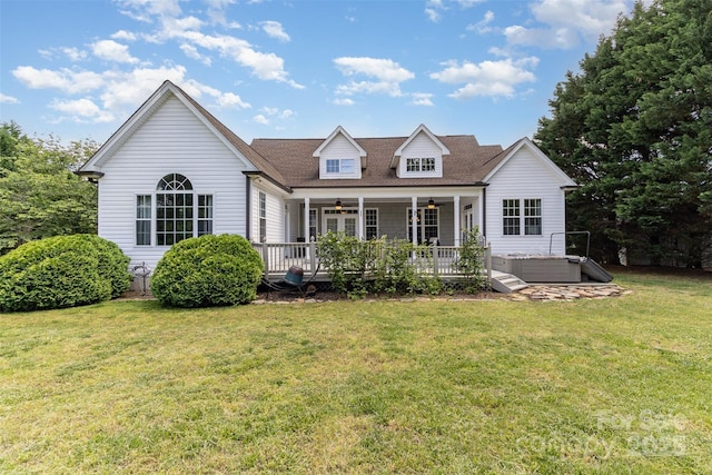 14807 Middlesborough Dr, Matthews, NC 28104 - view of front of house featuring a hot tub, a ceiling fan, a front lawn, and a wooden deck