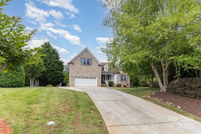 14807 Middlesborough Dr, Matthews, NC 28104 - traditional-style house with an attached garage, driveway, brick siding, and a front yard