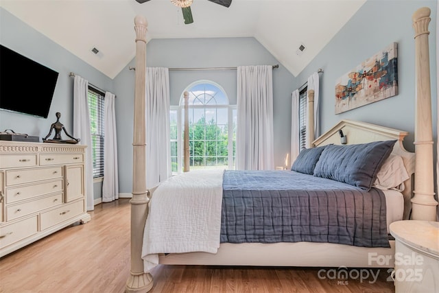 14807 Middlesborough Dr, Matthews, NC 28104 - bedroom featuring multiple windows, lofted ceiling, light wood-type flooring, and ceiling fan