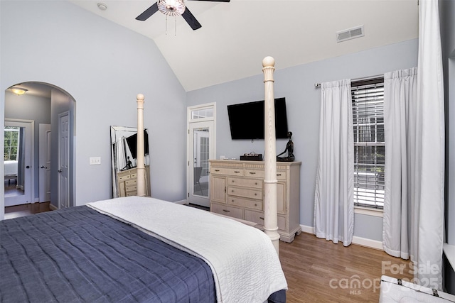 14807 Middlesborough Dr, Matthews, NC 28104 - bedroom featuring arched walkways, wood finished floors, lofted ceiling, baseboards, and a ceiling fan
