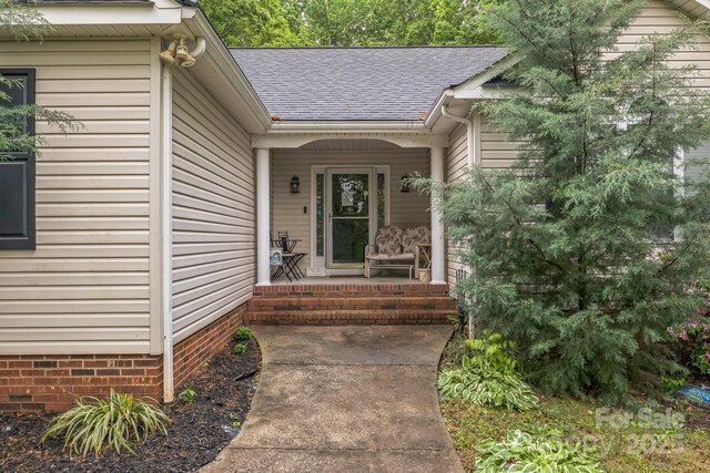 3585 Goodman Lake Rd, Salisbury, NC 28146 - doorway to property featuring roof with shingles and a porch