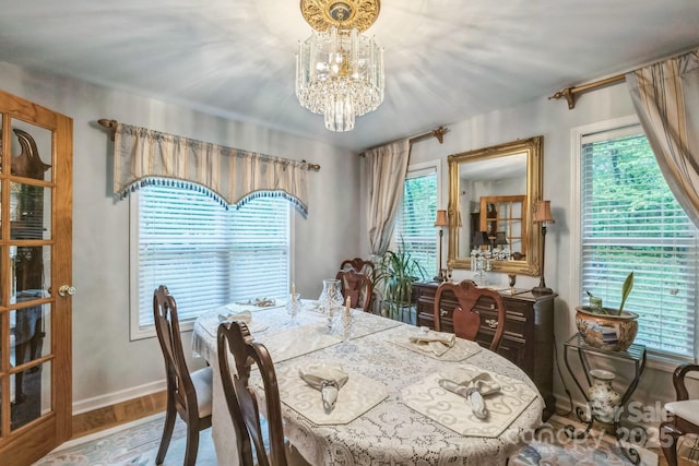 3585 Goodman Lake Rd, Salisbury, NC 28146 - dining room with wood finished floors, a chandelier, plenty of natural light, and baseboards