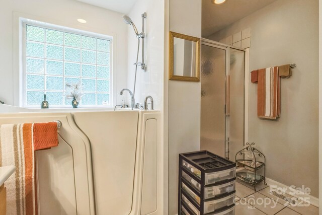 3585 Goodman Lake Rd, Salisbury, NC 28146 - bathroom featuring tile patterned floors, a bathtub, recessed lighting, and a stall shower
