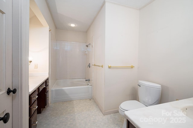 bathroom featuring toilet, baseboards, bathing tub / shower combination, and vanity