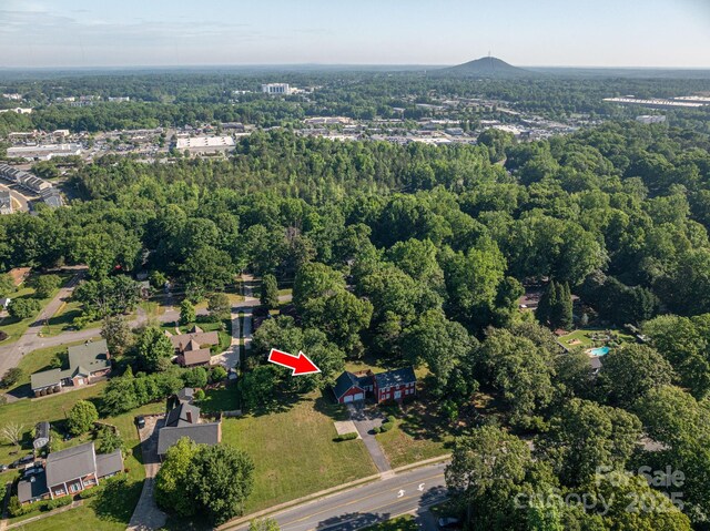 drone / aerial view with a view of trees