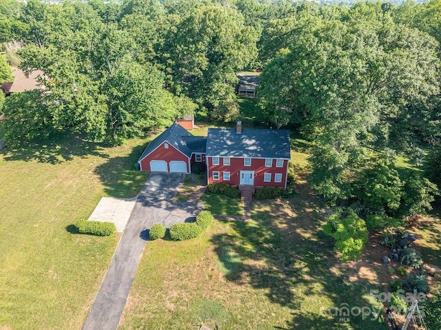 drone / aerial view with a view of trees