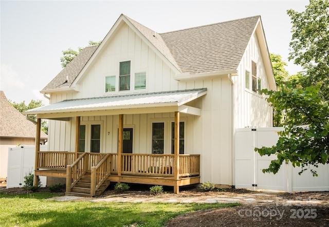 7 Mountain View Ave, Black Mountain, NC 28711 - view of front of home featuring covered porch, roof with shingles, board and batten siding, and a metal roof