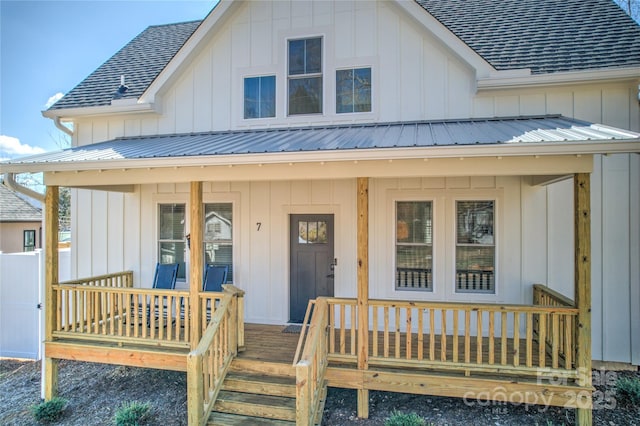 7 Mountain View Ave, Black Mountain, NC 28711 - view of front of property featuring a porch, a shingled roof, board and batten siding, and a metal roof