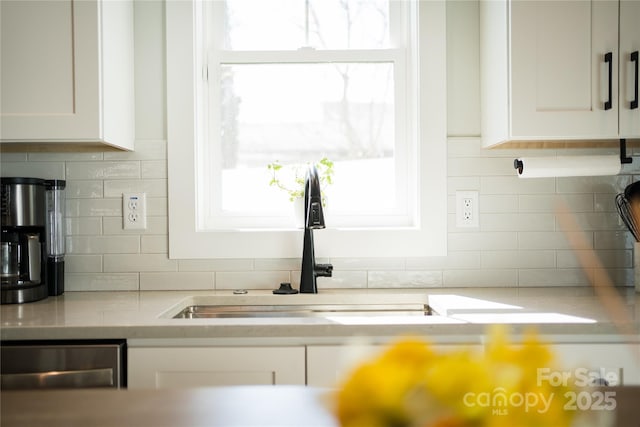 7 Mountain View Ave, Black Mountain, NC 28711 - kitchen with tasteful backsplash, light countertops, and white cabinets