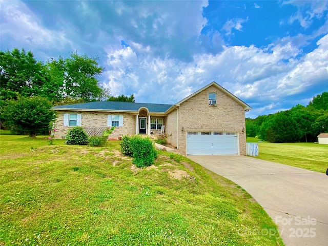 970 Mt Moriah Church Rd, China Grove, NC 28023 - view of front of property featuring an attached garage, concrete driveway, a front lawn, and brick siding