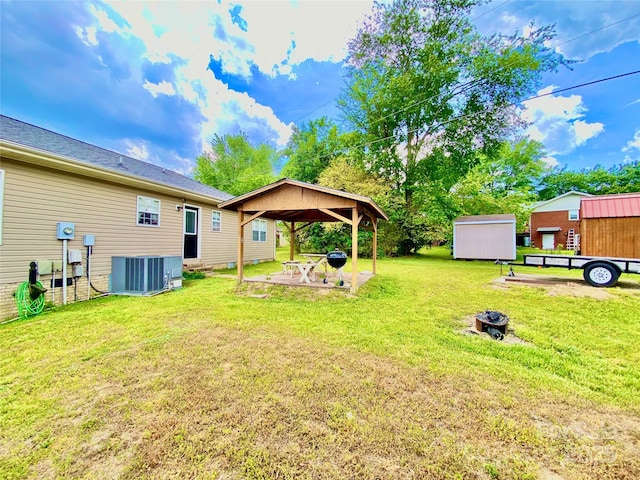 970 Mt Moriah Church Rd, China Grove, NC 28023 - view of yard with an outdoor structure, cooling unit, a shed, a gazebo, and an outdoor fire pit