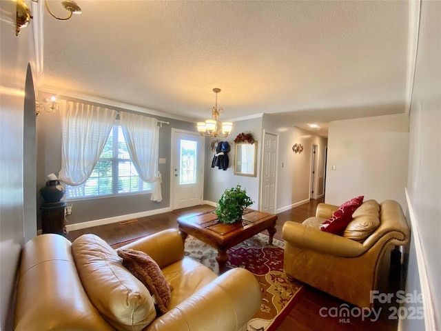 970 Mt Moriah Church Rd, China Grove, NC 28023 - living area featuring crown molding, a textured ceiling, baseboards, and wood finished floors