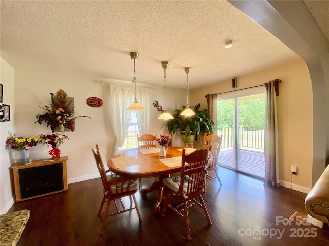970 Mt Moriah Church Rd, China Grove, NC 28023 - dining area with baseboards, arched walkways, a textured ceiling, and wood finished floors
