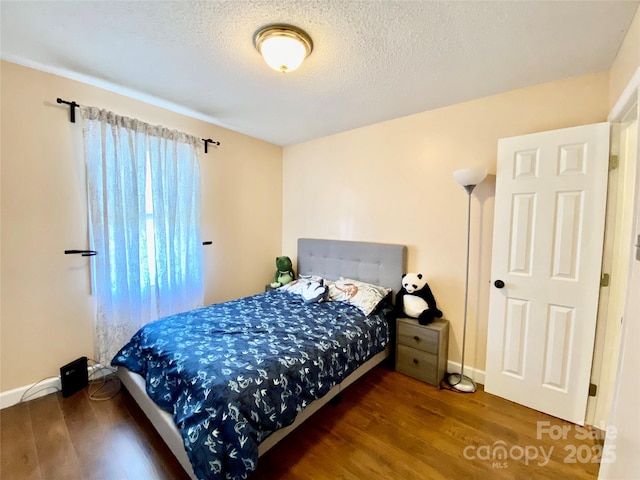 970 Mt Moriah Church Rd, China Grove, NC 28023 - bedroom with a textured ceiling, baseboards, and wood finished floors