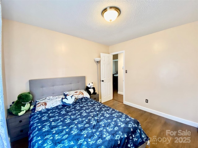 970 Mt Moriah Church Rd, China Grove, NC 28023 - bedroom with baseboards, a textured ceiling, and wood finished floors