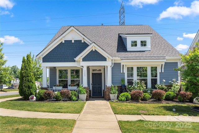 3588 County Down Ave, Kannapolis, NC 28081 - view of front of home featuring a shingled roof, a front lawn, and a porch