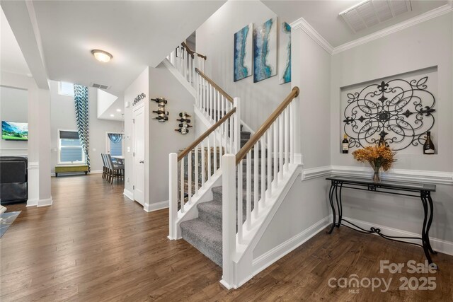 3588 County Down Ave, Kannapolis, NC 28081 - stairway featuring wood finished floors, baseboards, and crown molding