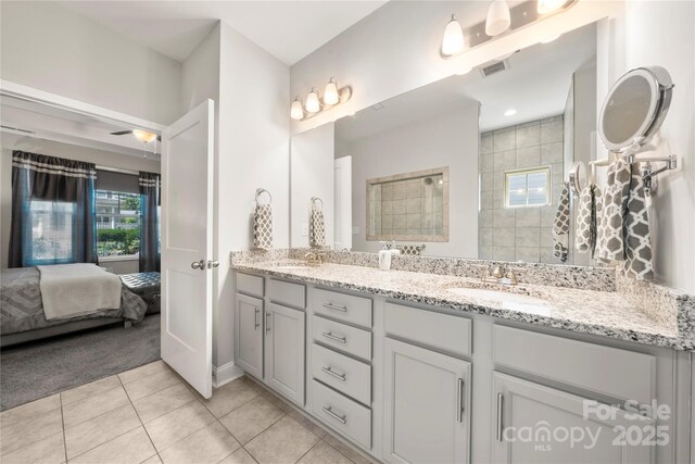 3588 County Down Ave, Kannapolis, NC 28081 - bathroom featuring tile patterned flooring, double vanity, walk in shower, and connected bathroom