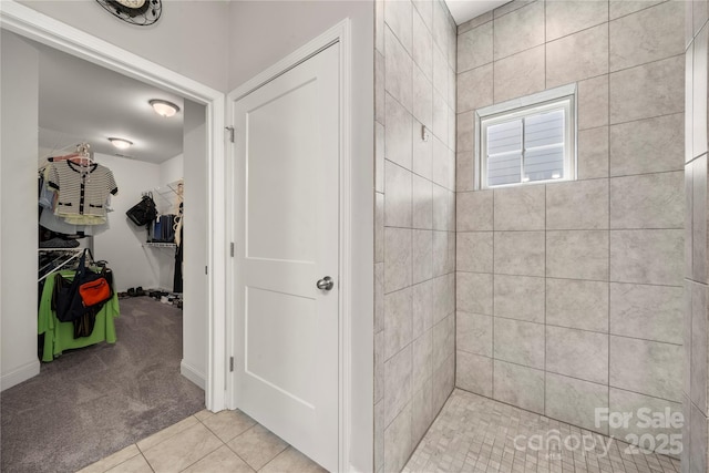 3588 County Down Ave, Kannapolis, NC 28081 - bathroom featuring a spacious closet, tiled shower, and tile patterned flooring