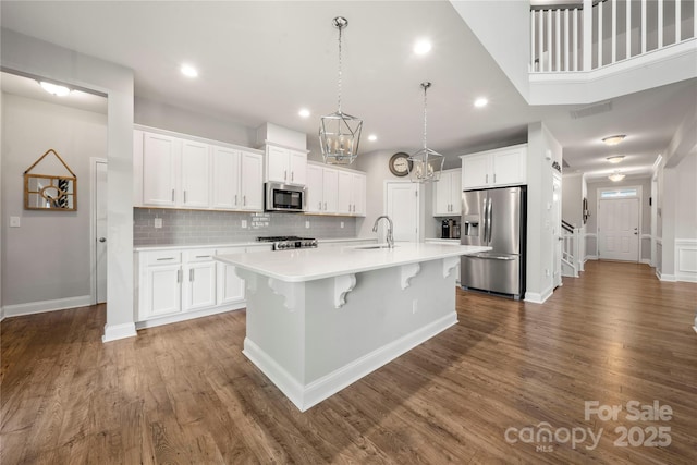 3588 County Down Ave, Kannapolis, NC 28081 - kitchen with appliances with stainless steel finishes, light countertops, backsplash, white cabinets, and recessed lighting
