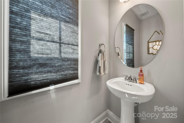3588 County Down Ave, Kannapolis, NC 28081 - bathroom with baseboards and plenty of natural light
