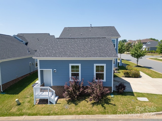 3588 County Down Ave, Kannapolis, NC 28081 - rear view of property with a shingled roof and a lawn