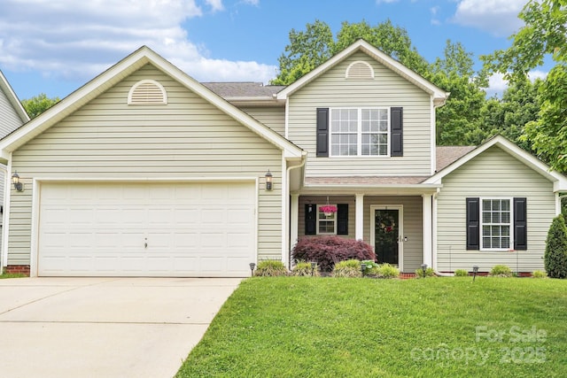 traditional-style house featuring a garage, covered porch, a front yard, a shingled roof, and concrete driveway