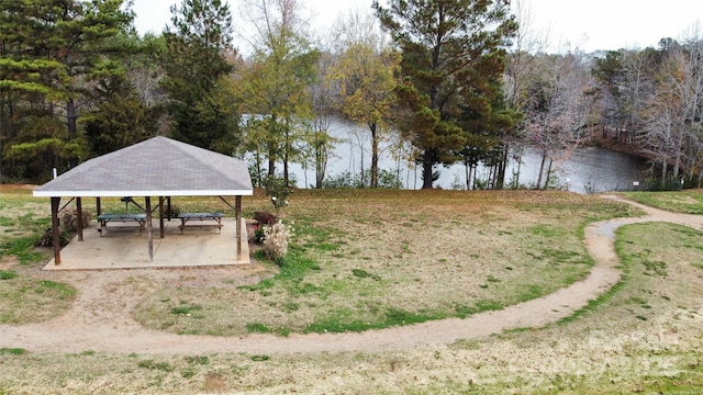 view of yard featuring a detached carport and a water view