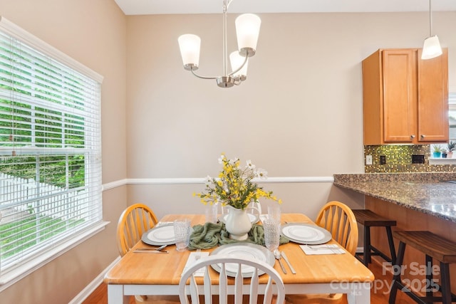 3032 Kilbeggan Dr, Clover, SC 29710 - dining room with a chandelier and wood finished floors