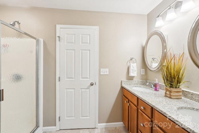 3032 Kilbeggan Dr, Clover, SC 29710 - bathroom with a stall shower, double vanity, and baseboards