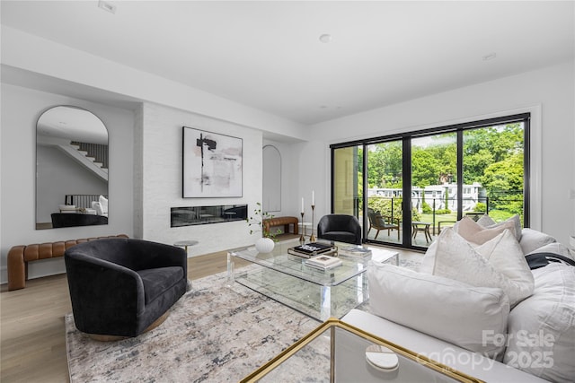 614 Queens Rd, Charlotte, NC 28207 - living area featuring wood finished floors and a glass covered fireplace