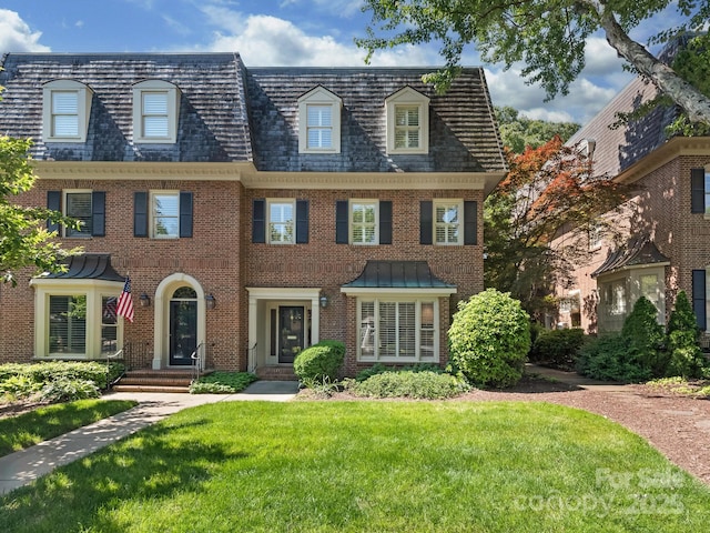 232 Perrin Pl, Charlotte, NC 28207 - view of front of house featuring brick siding, a front lawn, and mansard roof