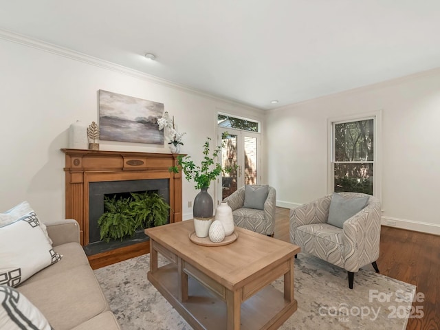 232 Perrin Pl, Charlotte, NC 28207 - living room featuring ornamental molding, wood finished floors, baseboards, and a fireplace with flush hearth