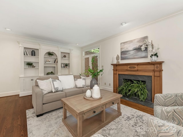 232 Perrin Pl, Charlotte, NC 28207 - living room with wood finished floors, ornamental molding, a fireplace with flush hearth, and baseboards