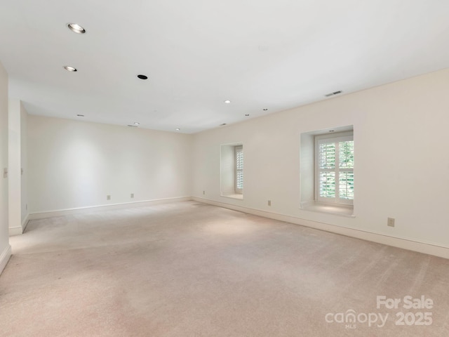232 Perrin Pl, Charlotte, NC 28207 - unfurnished room with light colored carpet, baseboards, and recessed lighting