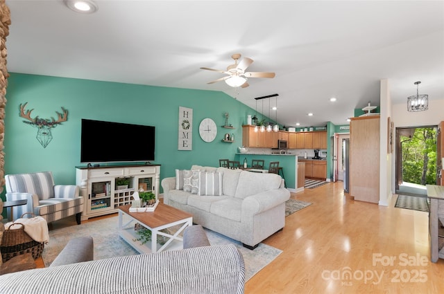 living area with recessed lighting, ceiling fan, light wood-type flooring, and lofted ceiling