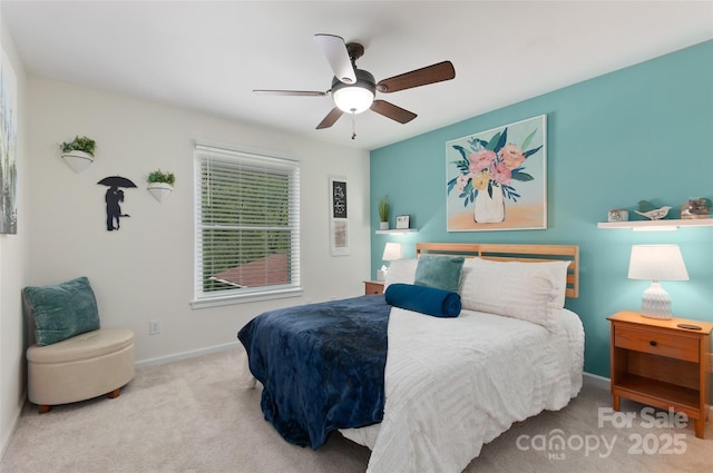 carpeted bedroom with baseboards and ceiling fan