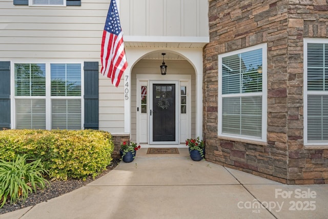 entrance to property with stone siding