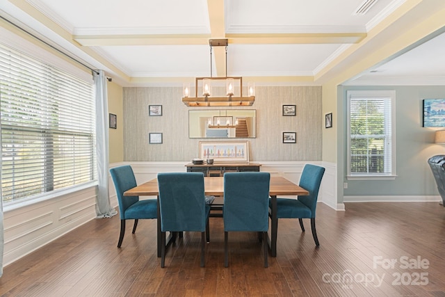 dining space with wallpapered walls, a chandelier, and hardwood / wood-style floors