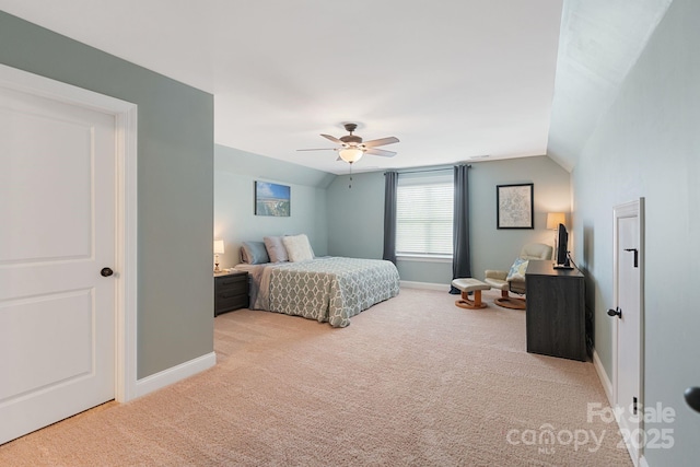 carpeted bedroom with baseboards, ceiling fan, and vaulted ceiling