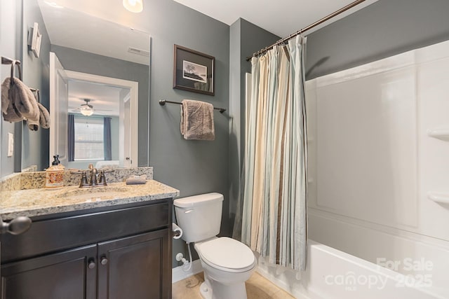 bathroom with ceiling fan, visible vents, vanity, toilet, and shower / tub combo with curtain