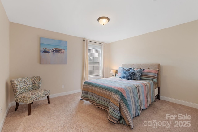 carpeted bedroom featuring baseboards
