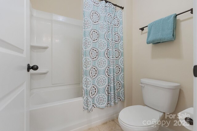 full bathroom with tile patterned floors, toilet, and shower / bath combination with curtain