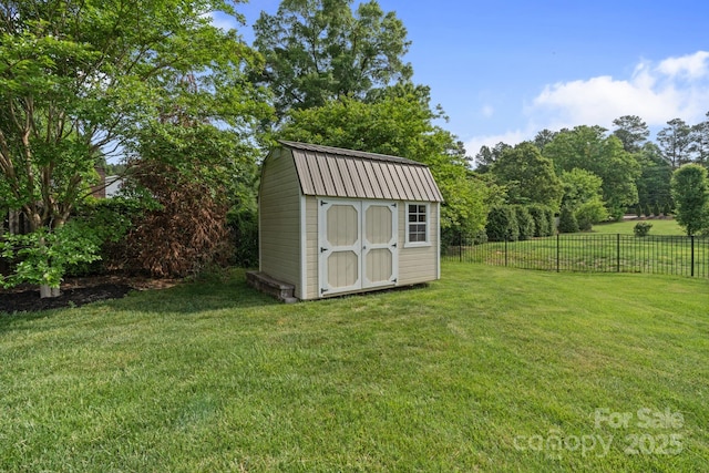 view of shed with fence